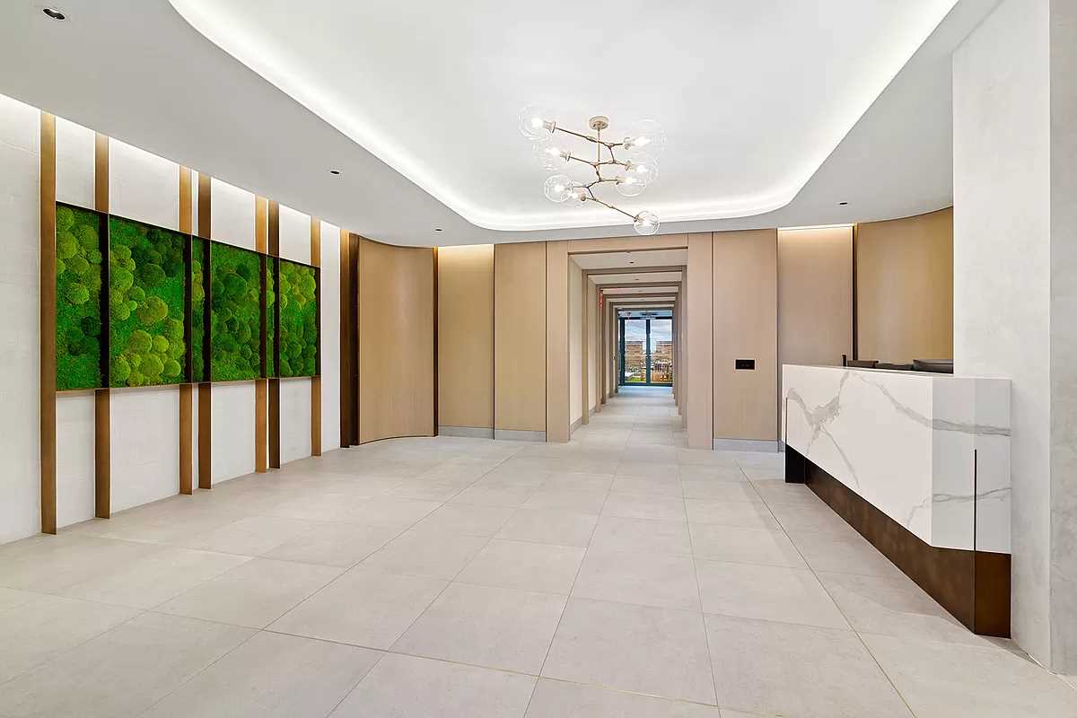 Lobby Renovation, Manhattan Construction, Custom Reception Desk, Modern Interior Design, Green Wall Installation, Premium Flooring, Contemporary Wall Paneling, NYC Building Codes, Construction Permits, Luxurious Lobbies.